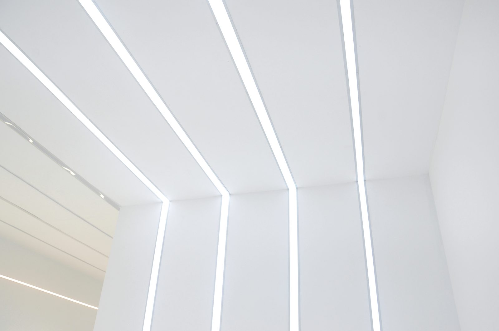 About Helian | LED Aluminum Profiles & Linear Lighting 9 Recessed LED ceiling profile shown as a continuous ceiling line in the showroom